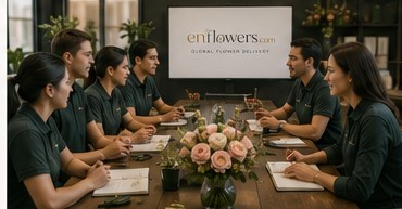 The enflowers florist team meeting around a worktable