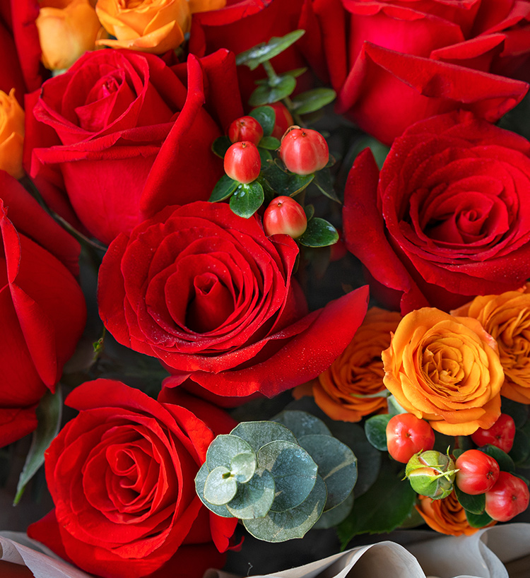 Sixteen Orange Roses & Eucalyptus Bouquet — alternate view